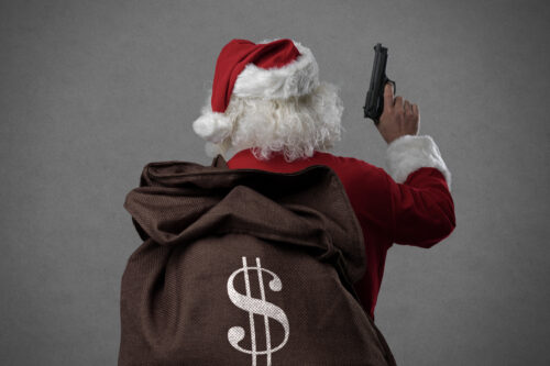 Criminal disguised as Santa Claus holding a gun and carrying a sack full of stolen money,